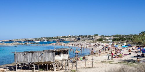 Es Pujols sun-bleached timber boat shelters