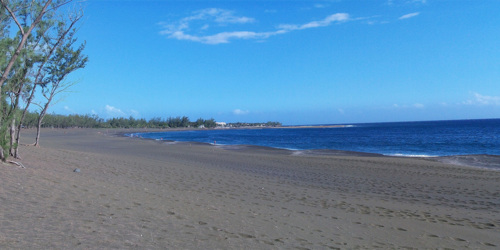 Black sand on Etang-Salé beach in La Réunion